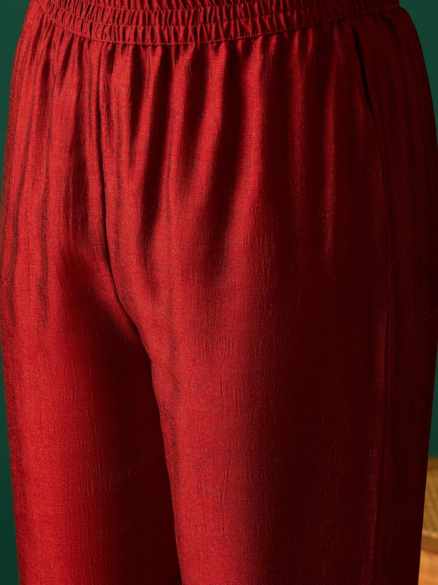 Sleeveless Maroon Straight-Fit Kurta With Mirror Lace Detailing And Boat Neck, Paired With Solid Ankle-Length Trousers For A Bold And Elegant Ethnic Look