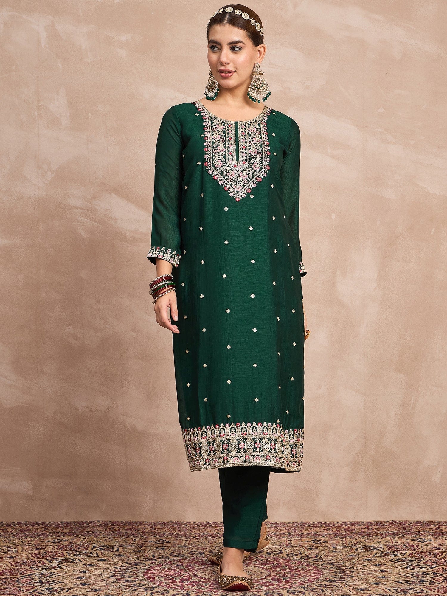 Elegant In Deep Green, This Straight-Fit Kurta With Intricate Zari-Embroidered Yoke Is Paired With Ankle-Length Solid Trousers And A Matching Zari-Accented Dupatta