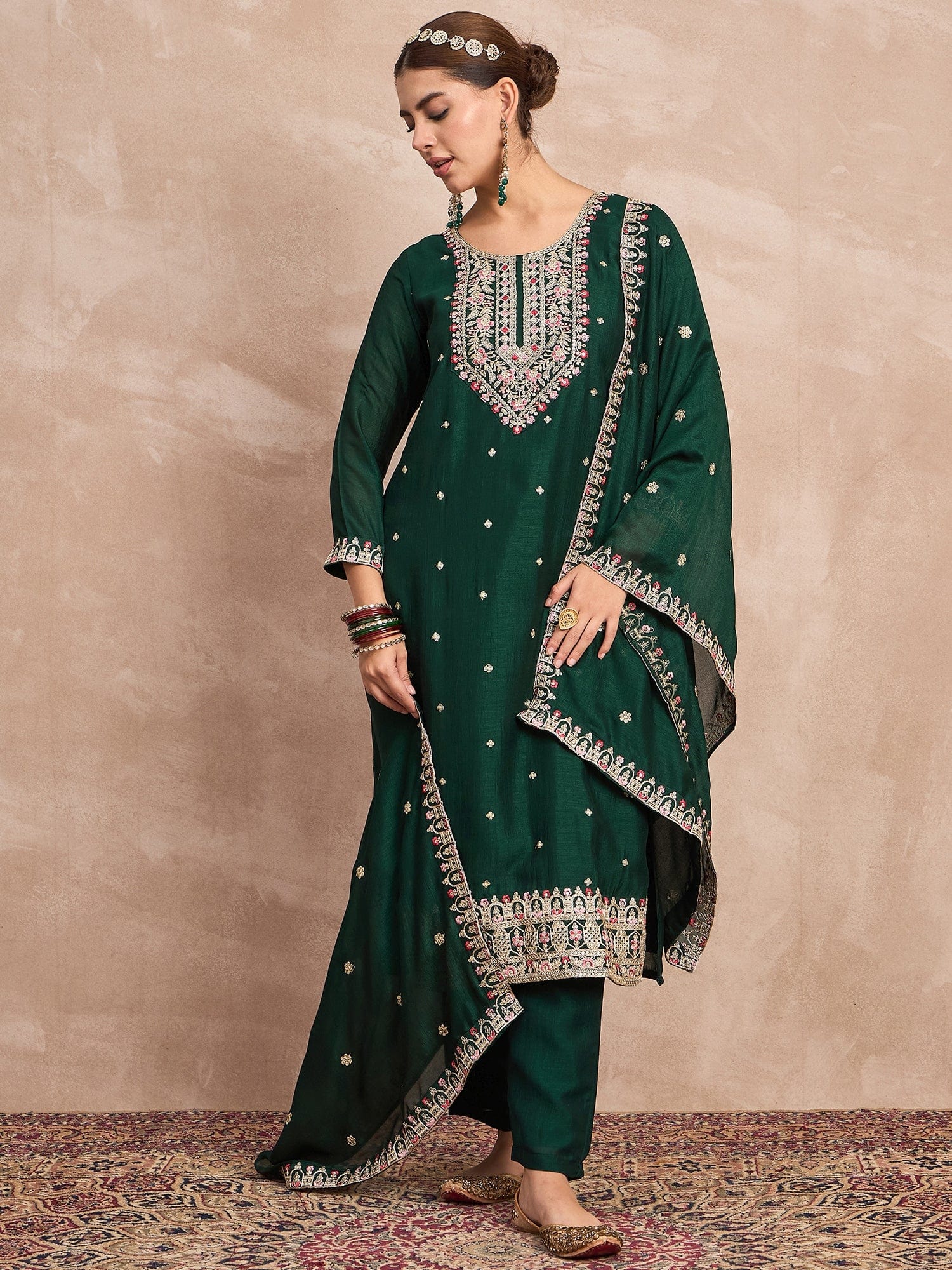 Elegant In Deep Green, This Straight-Fit Kurta With Intricate Zari-Embroidered Yoke Is Paired With Ankle-Length Solid Trousers And A Matching Zari-Accented Dupatta