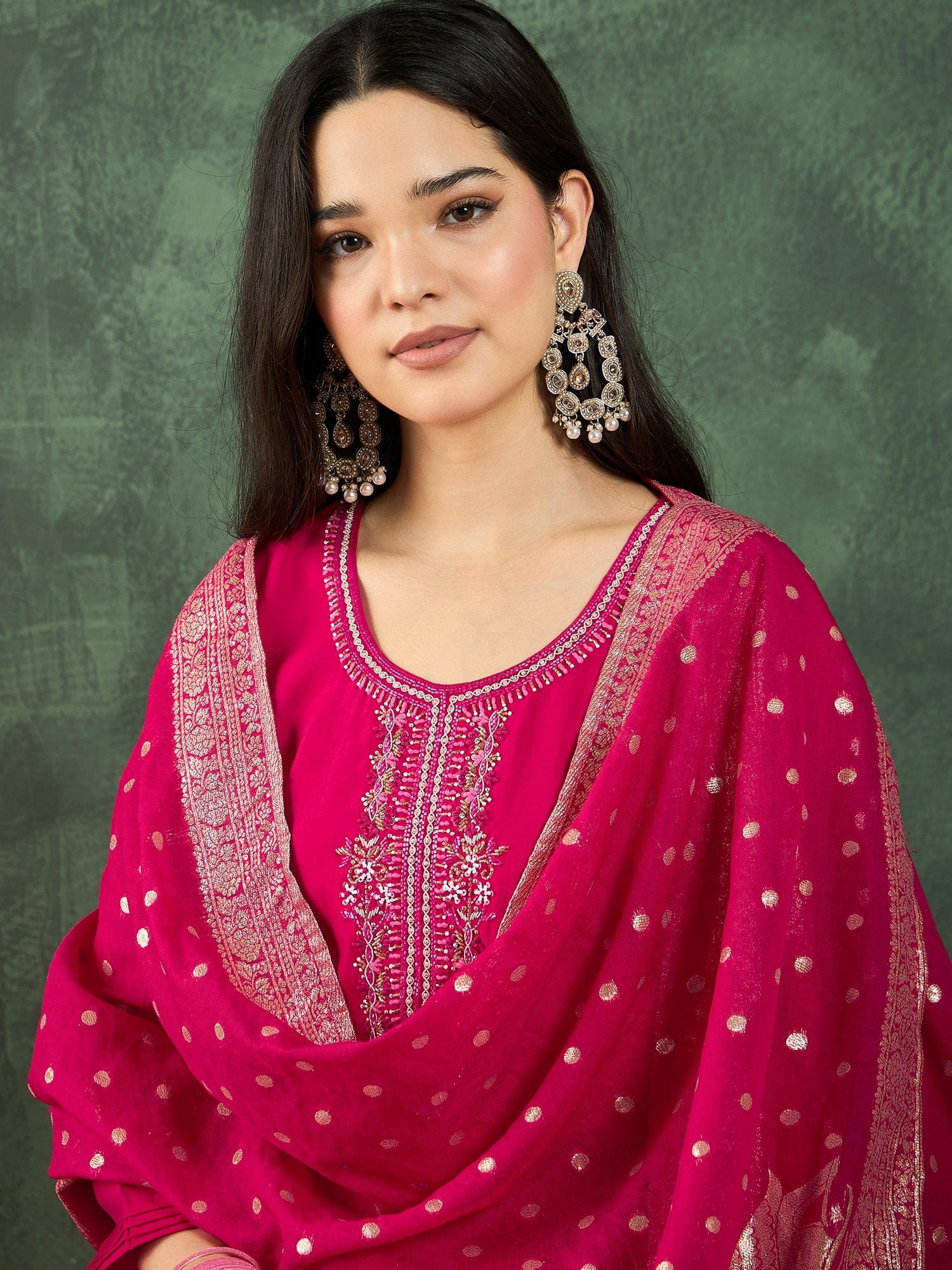 Fuchsia kurta set featuring a bead-embellished yoke, solid ankle-length trousers, and a brocade dupatta