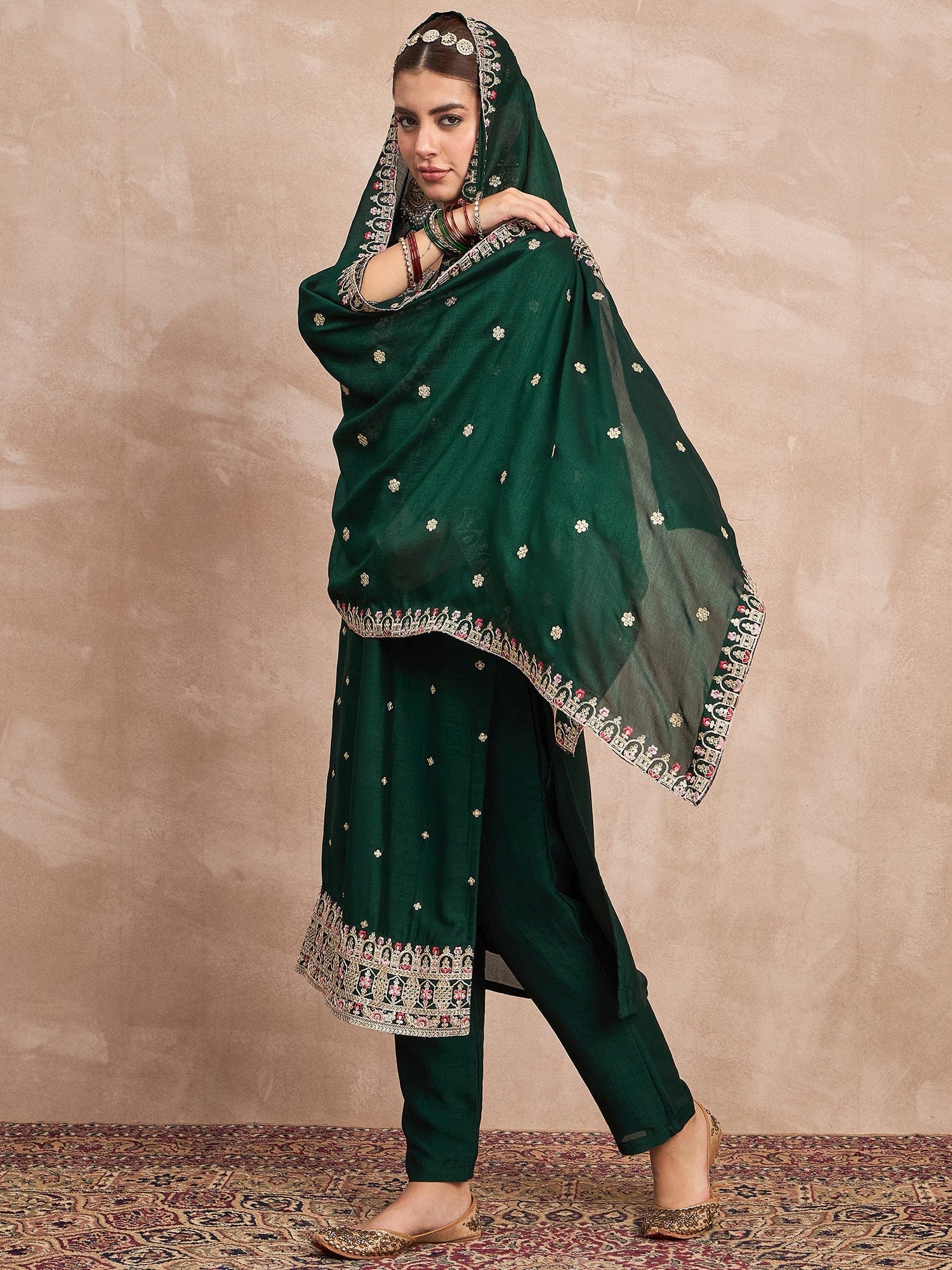 Elegant In Deep Green, This Straight-Fit Kurta With Intricate Zari-Embroidered Yoke Is Paired With Ankle-Length Solid Trousers And A Matching Zari-Accented Dupatta