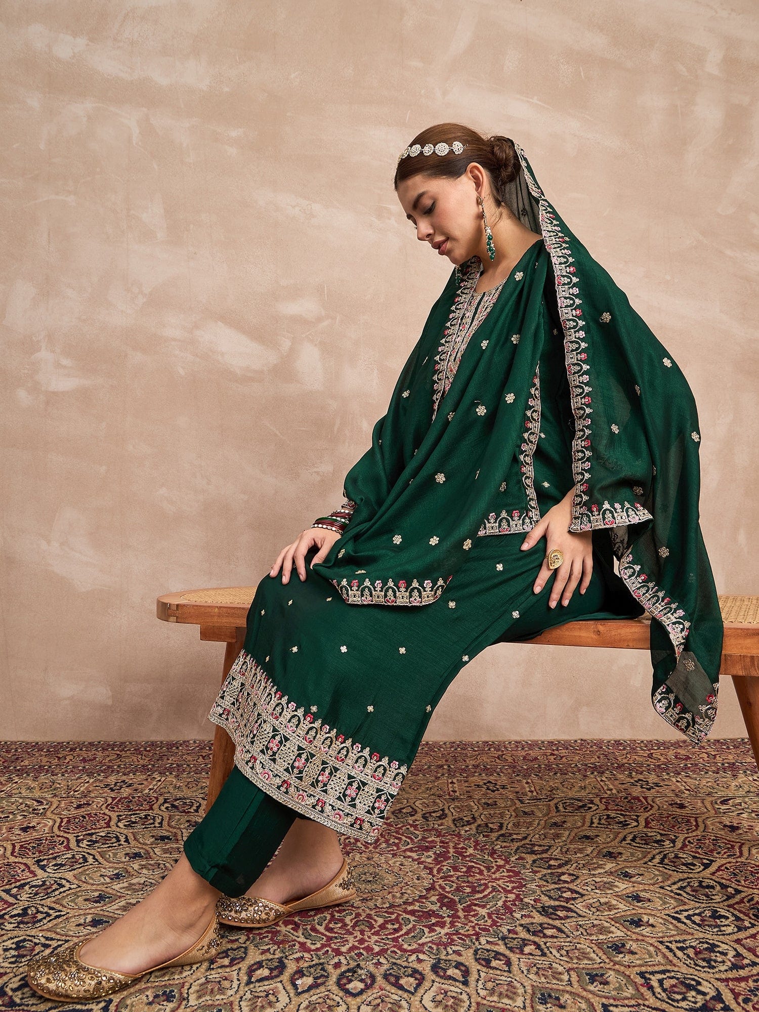 Elegant In Deep Green, This Straight-Fit Kurta With Intricate Zari-Embroidered Yoke Is Paired With Ankle-Length Solid Trousers And A Matching Zari-Accented Dupatta