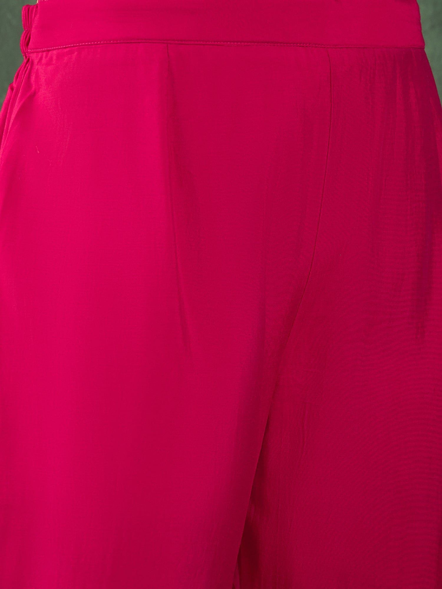 Fuchsia kurta set featuring a bead-embellished yoke, solid ankle-length trousers, and a brocade dupatta