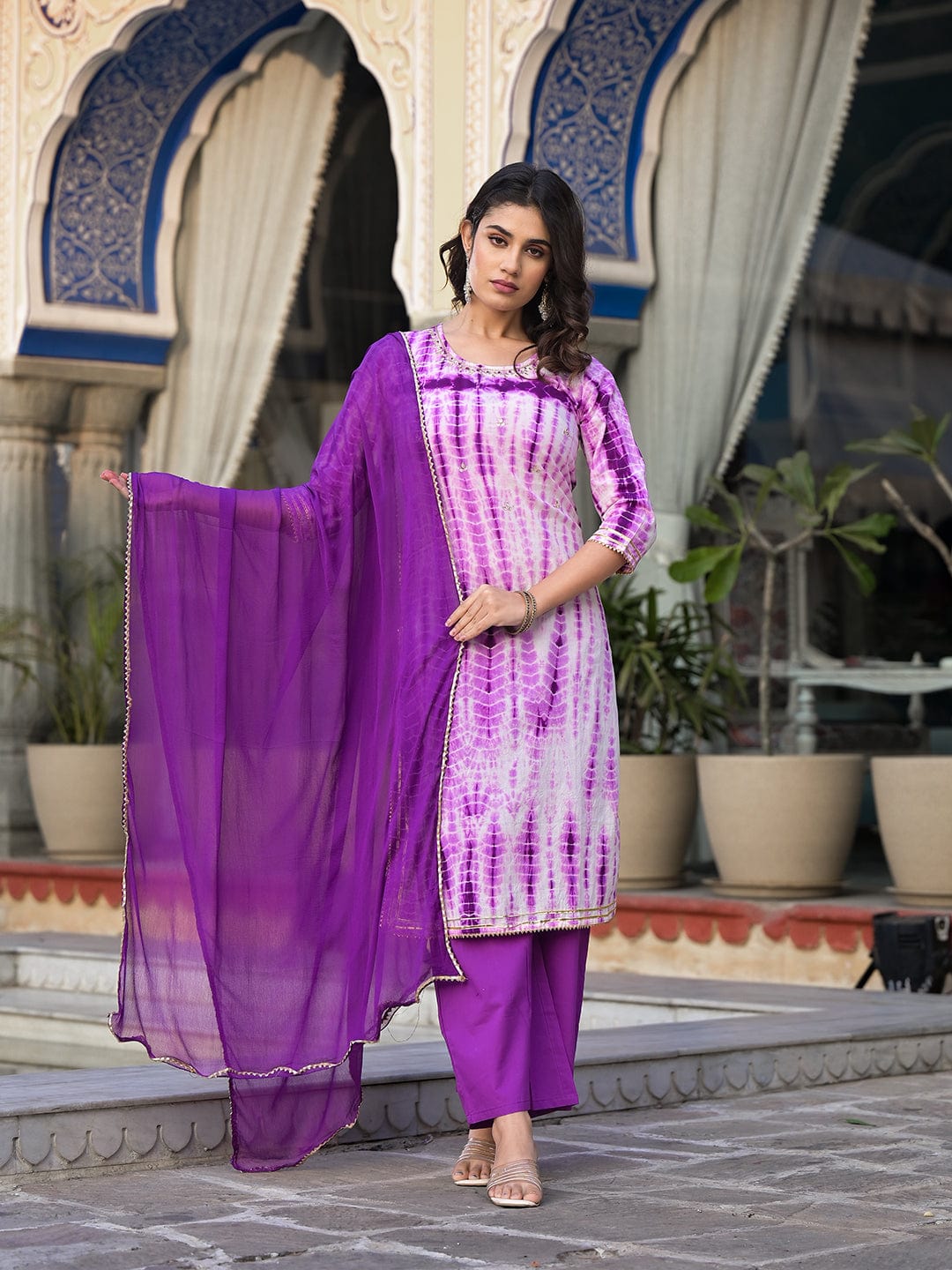 Varanga straight kurta with round neck paired with blue solid palazzo and blue solid dupatta.