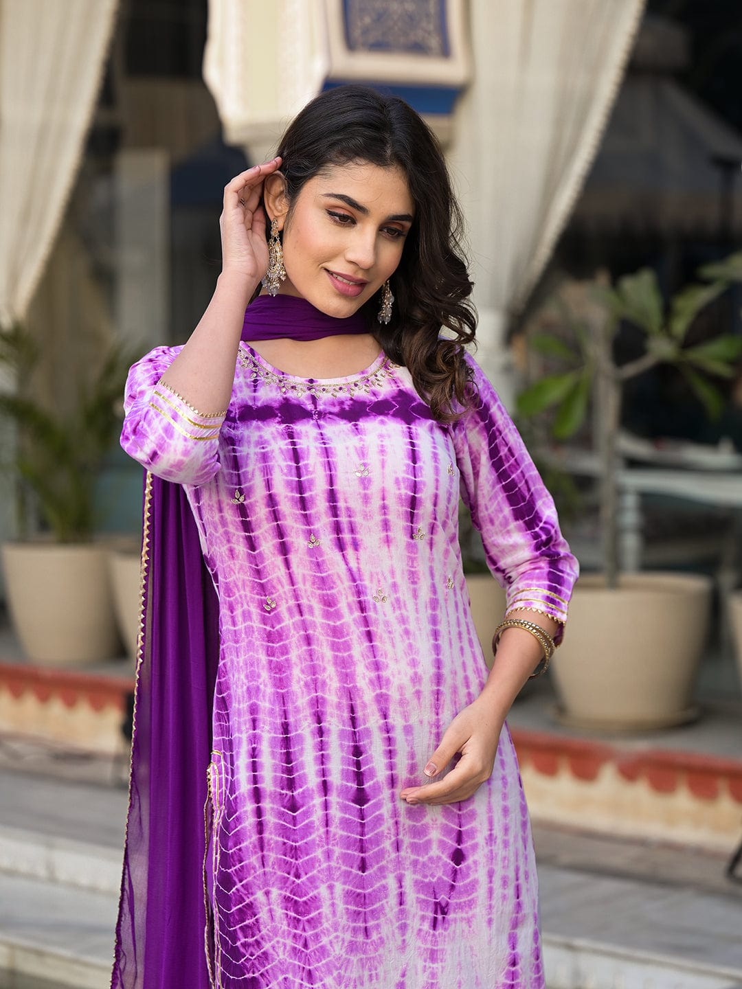 Varanga straight kurta with round neck paired with blue solid palazzo and blue solid dupatta.