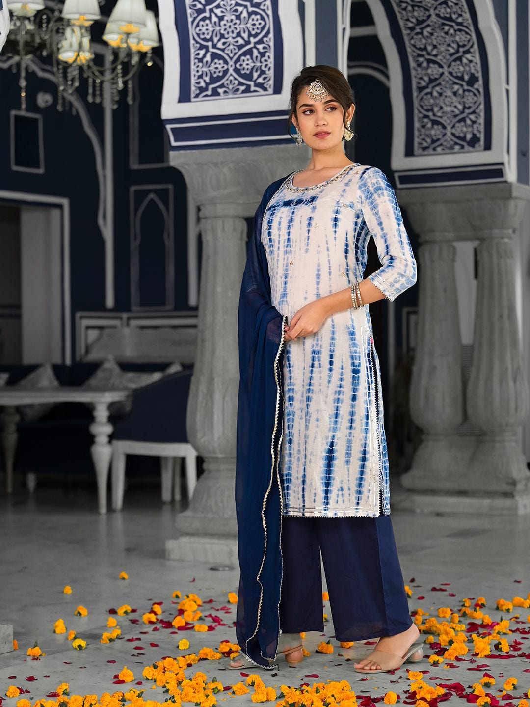 Varanga straight kurta with round neck paired with blue solid palazzo and blue solid dupatta.