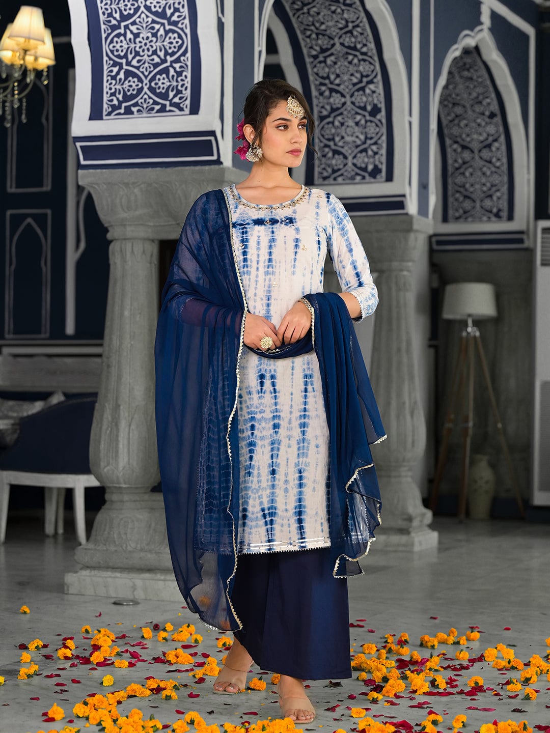 Varanga straight kurta with round neck paired with blue solid palazzo and blue solid dupatta.