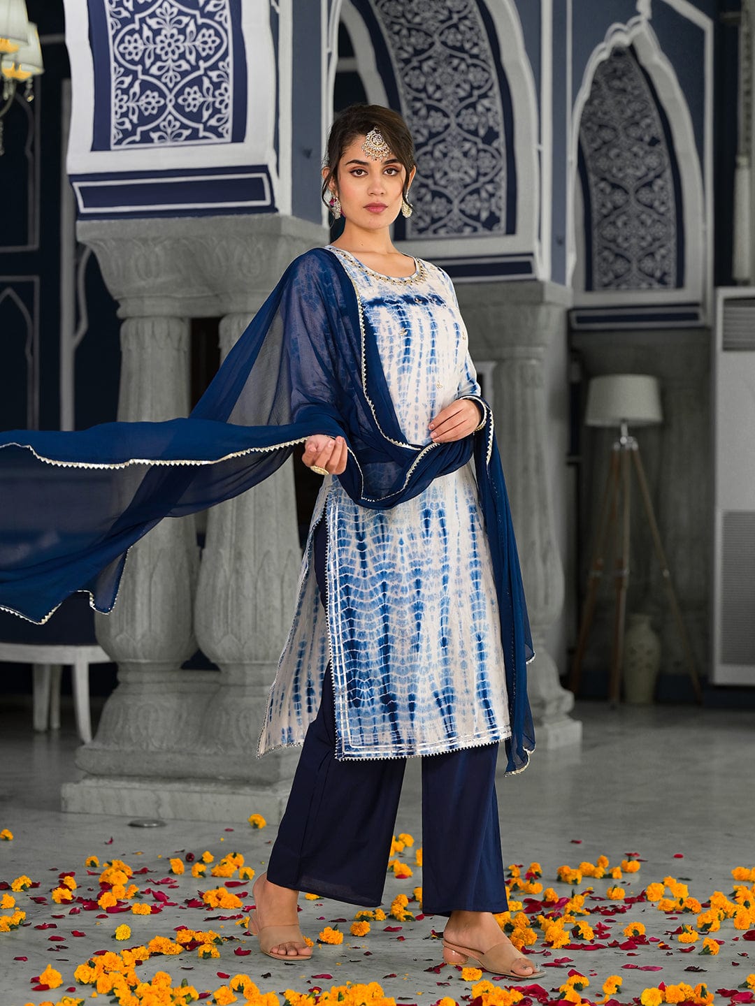 Varanga straight kurta with round neck paired with blue solid palazzo and blue solid dupatta.