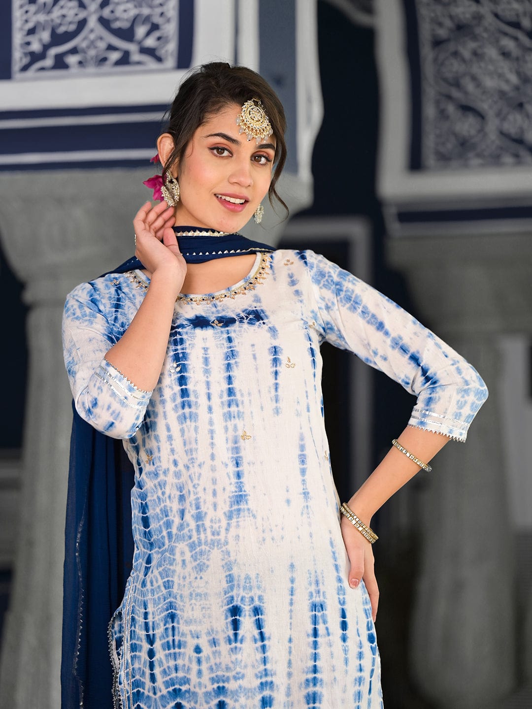 Varanga straight kurta with round neck paired with blue solid palazzo and blue solid dupatta.