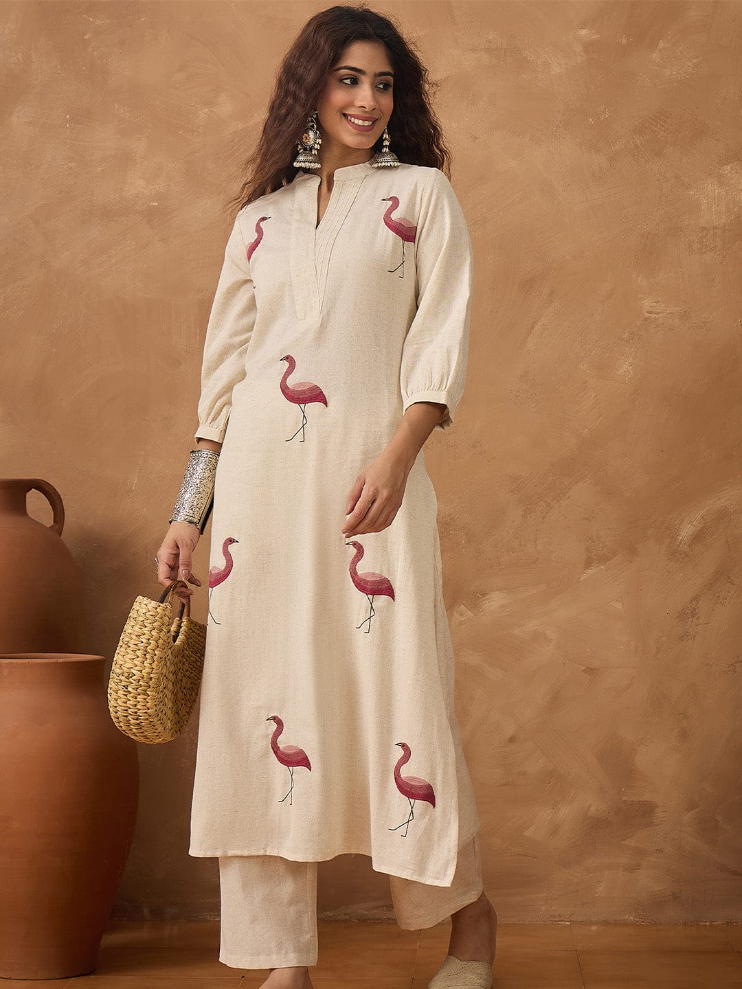 Flamingo embroidered kurta paired with solid trousers