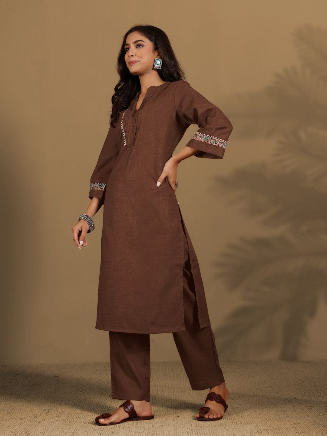 Varanga Women Brown Mandarin Collar Thread Embroidered With Pleate Deatialing Kurta Paired With Bottom
