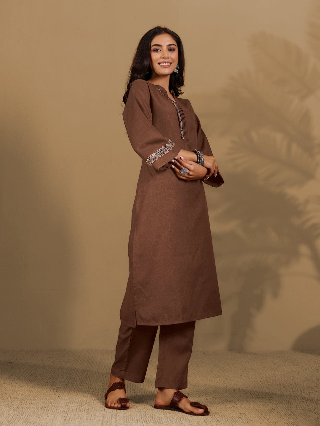Varanga Women Brown Mandarin Collar Thread Embroidered With Pleate Deatialing Kurta Paired With Bottom