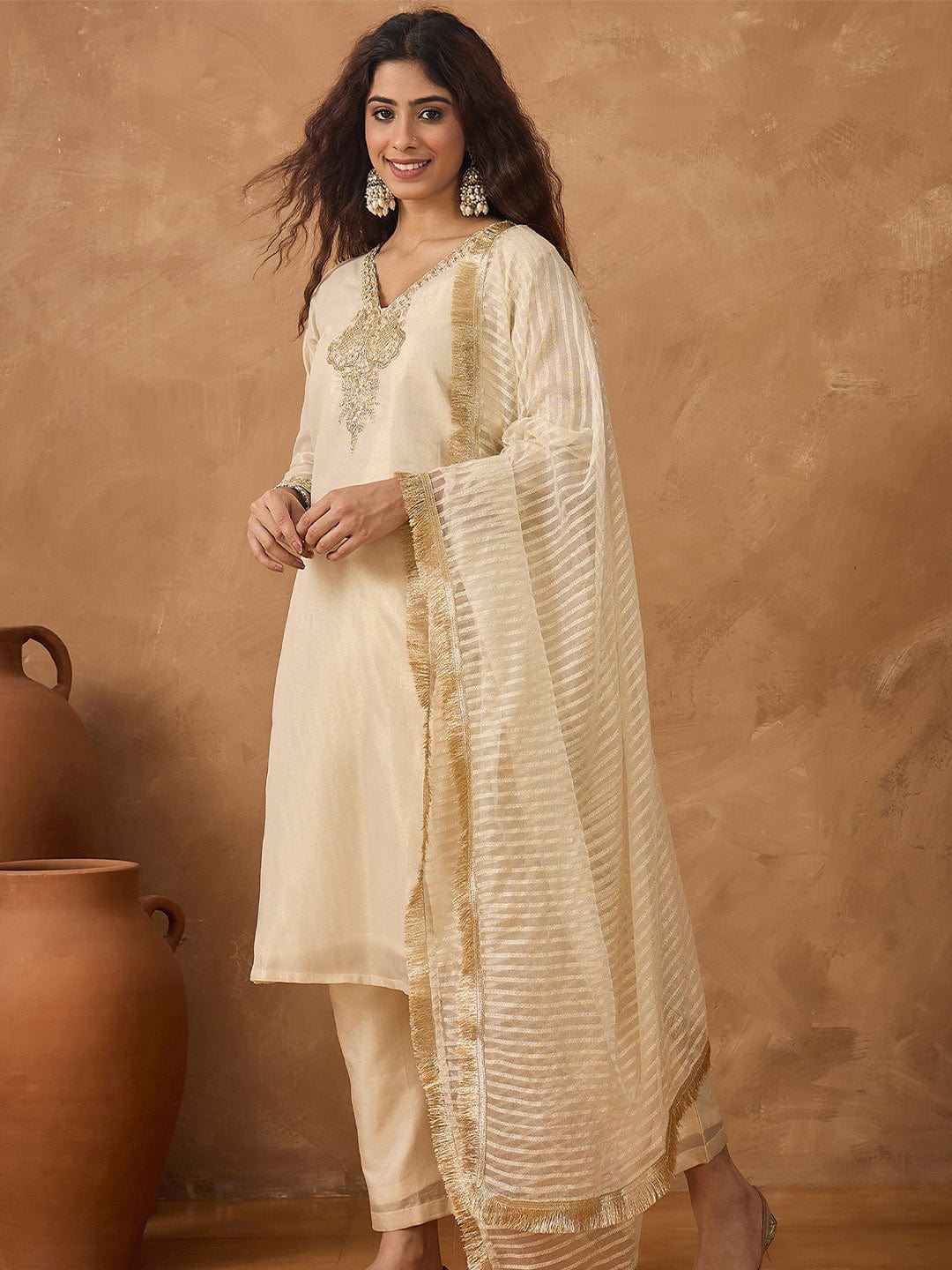 Shimmer Kurta with gold thread embroidery on neck paird with trousers and lurex dupatta