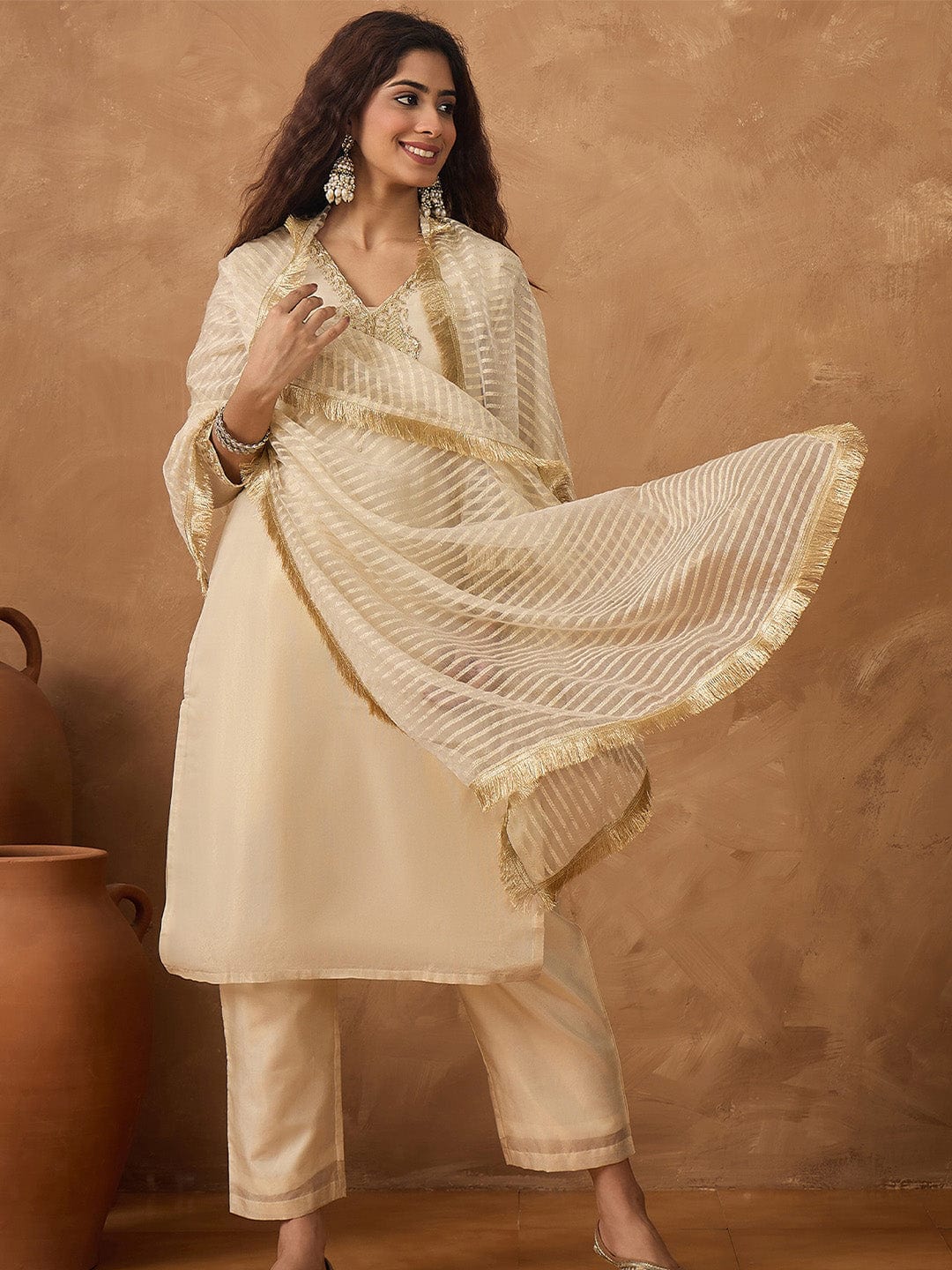 Shimmer Kurta with gold thread embroidery on neck paird with trousers and lurex dupatta