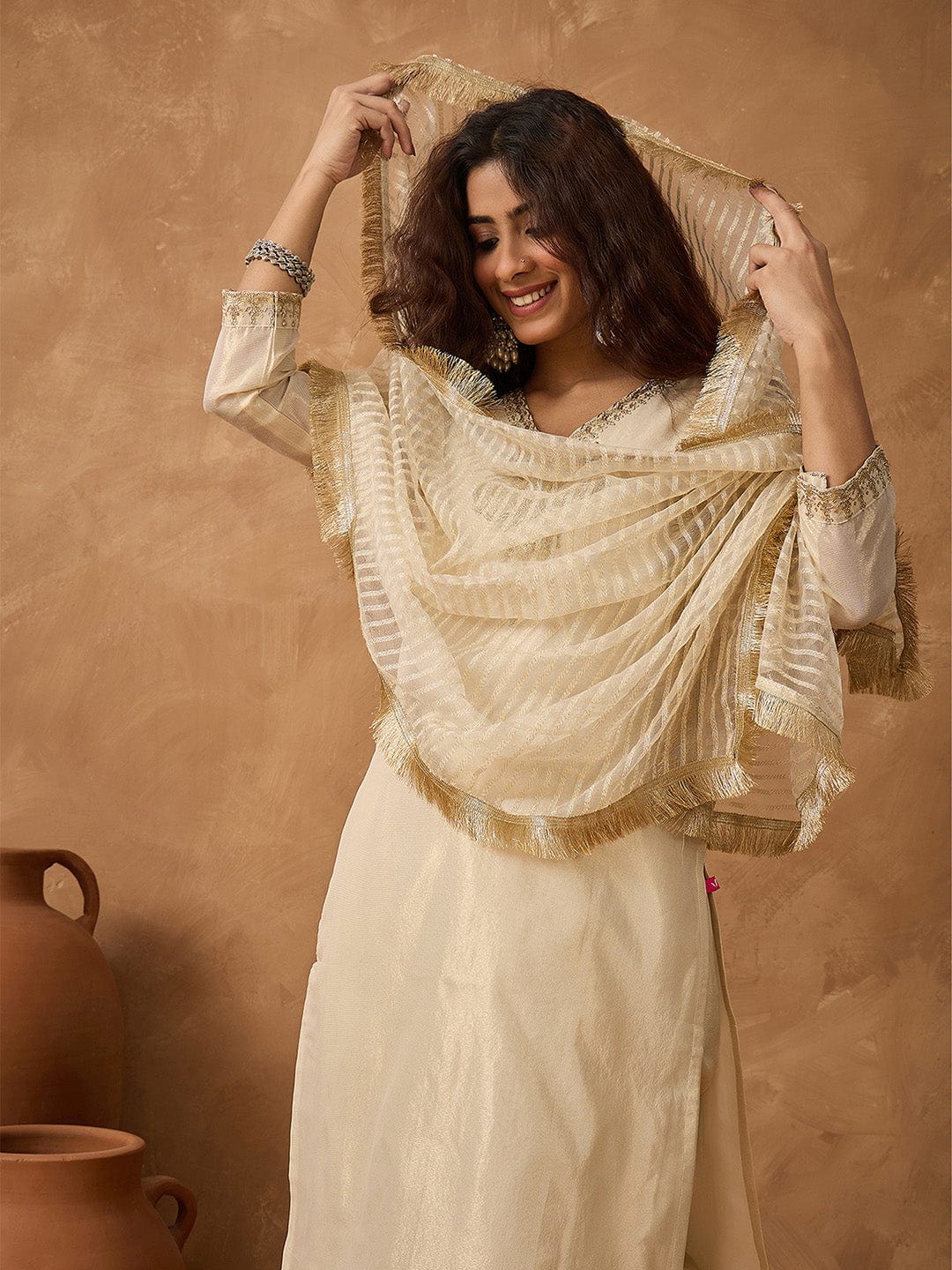 Shimmer Kurta with gold thread embroidery on neck paird with trousers and lurex dupatta