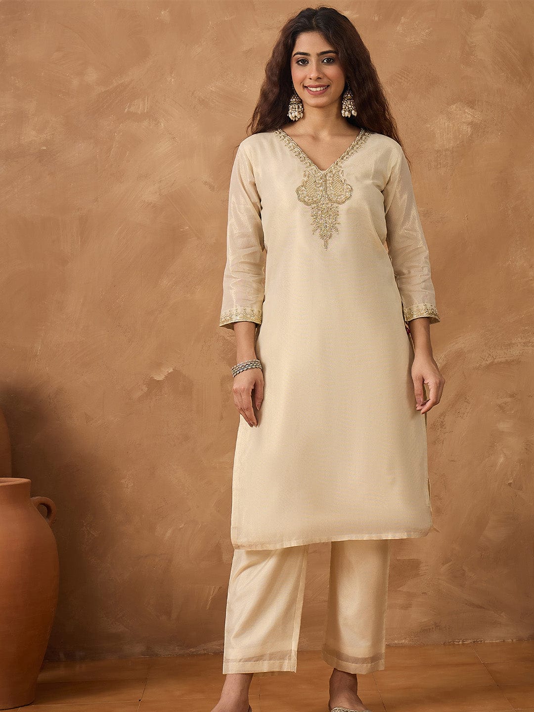 Shimmer Kurta with gold thread embroidery on neck paird with trousers and lurex dupatta