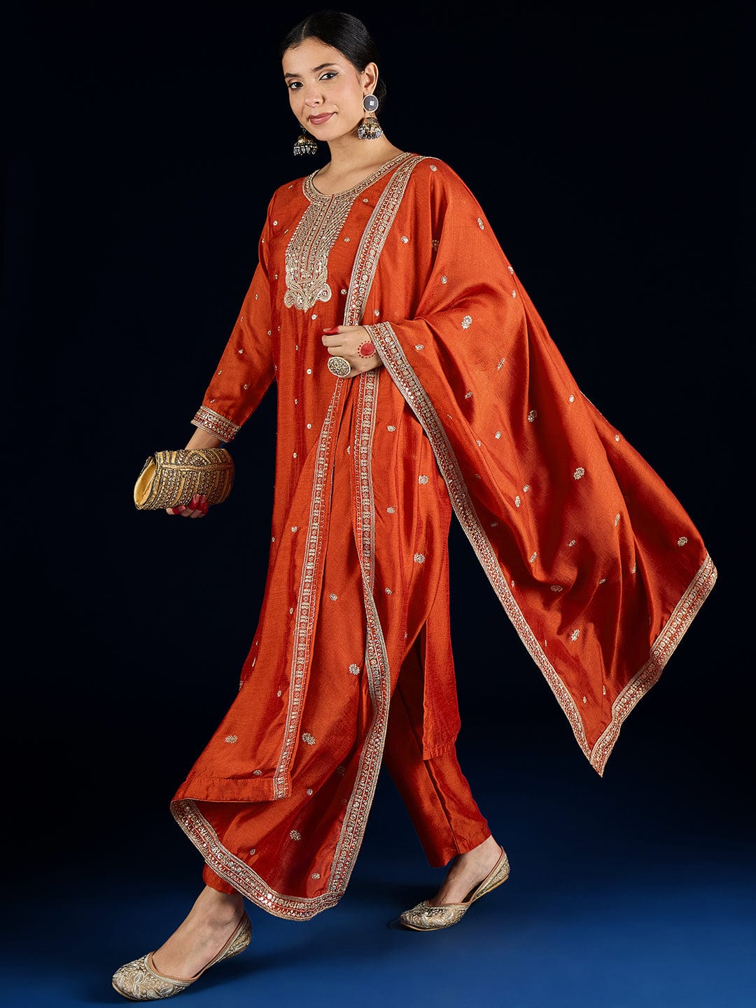 Varanga Graceful Rust 3-Piece Set Featuring A Zari-Embroidered Kurta, Solid Ankle-Length Trousers, And An Elegant Embroidered Dupatta.