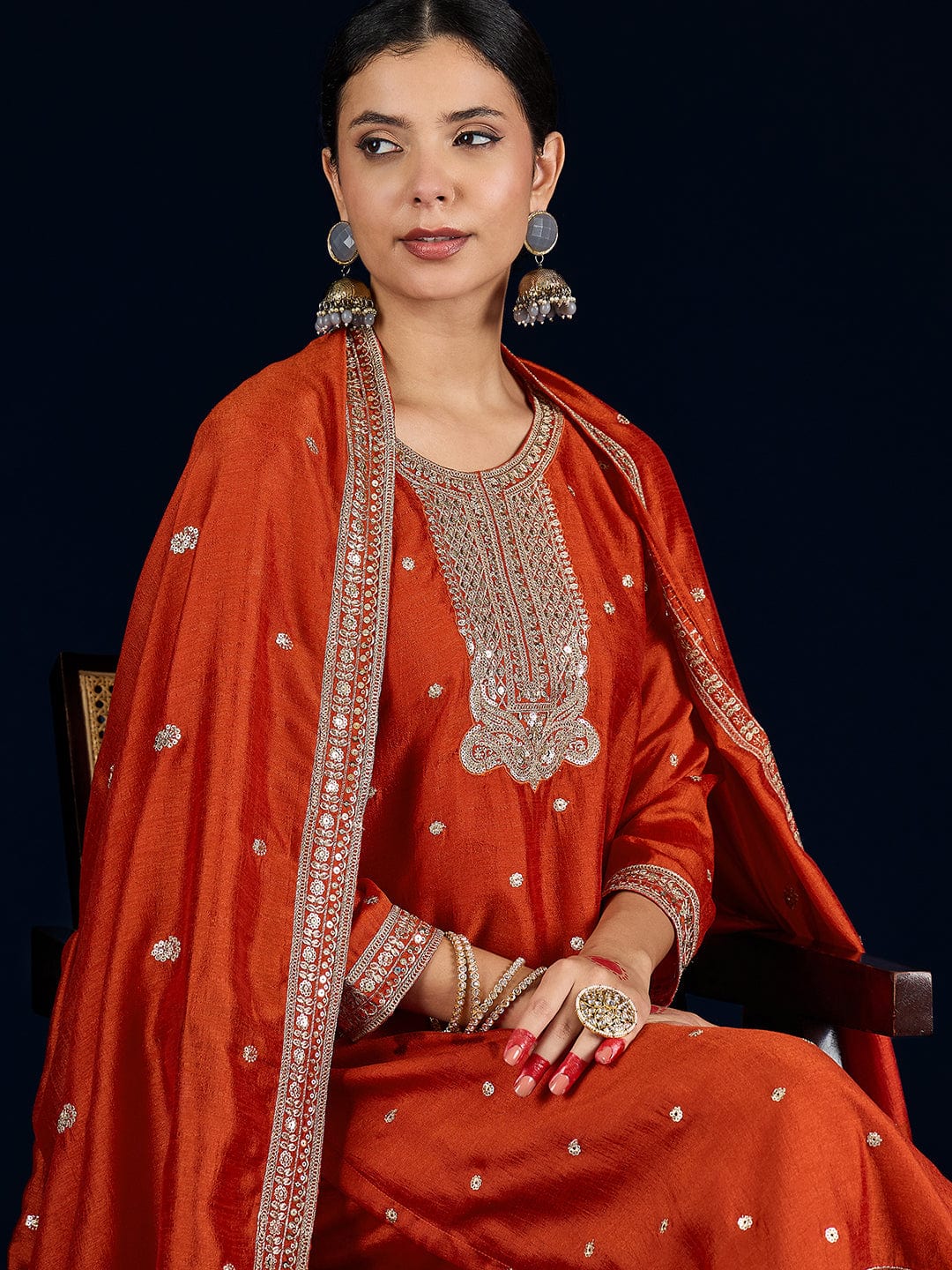 Varanga Graceful Rust 3-Piece Set Featuring A Zari-Embroidered Kurta, Solid Ankle-Length Trousers, And An Elegant Embroidered Dupatta.