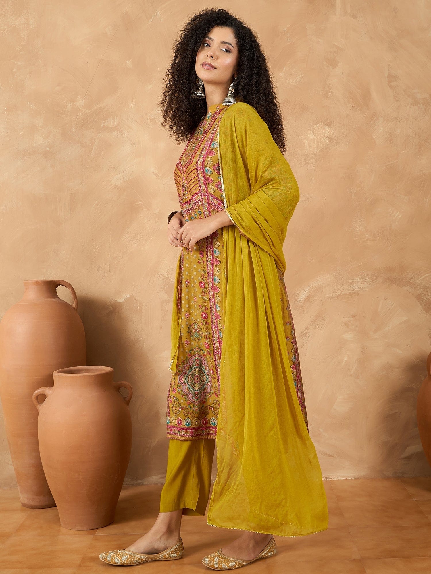 varanga Women A Mustard Ethnic-Printed Kurta Set With Bead And Stone Detailing, Paired With Solid Trousers And A Dupatta Perfect For Festive Celebrations With A Touch Of Contemporary Charm.