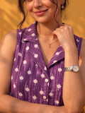 A Chic Sleeveless Printed Top With A Collared V-Neck Design, Perfect For Effortless Casual And Summer Styling.