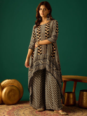 A Stylish Black And White Striped Kurta Paired With Fit-And-Flared Printed Trousers, Blending Classic Straight-Fit Elegance With A Contemporary Edge
