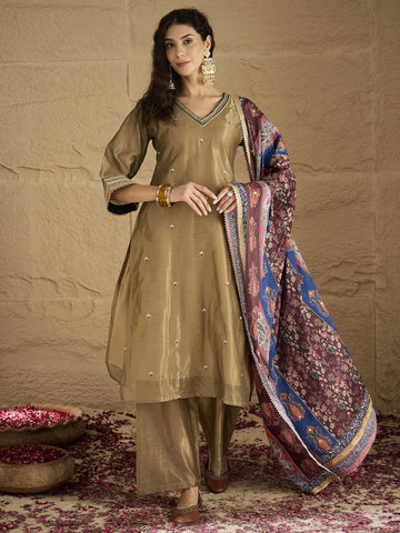 Varanga Women Radiate Festive Charm In This Gold Shimmer Kurta Set With Intricate Lace Detailing, Solid Ankle-Length Trousers, And Printed Dupatta.