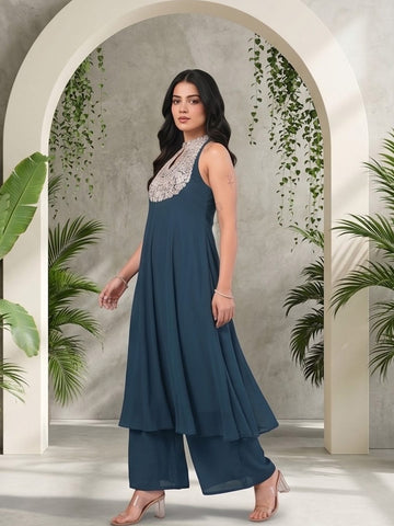 Varanga Women Blue Yoke Embroidered Sleeveless Flared Kurta With Trousers.