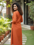 Orange kurta with mirror-detailed round neck paired with a matching trouser for a chic ethnic look.