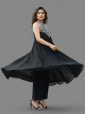 Black halter-neck A-line kurta featuring delicate white floral embroidery with matching solid trousers.