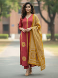 Rust Anarkali kurta set featuring multicolour buta prints, embroidered V-neck and sleeves, paired with solid straight-fit trousers and a tasselled dupatta.