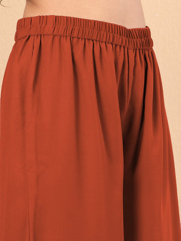 Varanga Women Nude Yoke Embroidered Sleeveless Flared Kurta With Trousers.