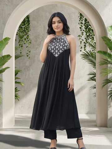 Black halter-neck A-line kurta featuring delicate white floral embroidery with matching solid trousers.