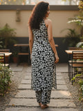 Sleeveless halter-neck floral kurta set in black and white tone, styled with printed full-length trousers.