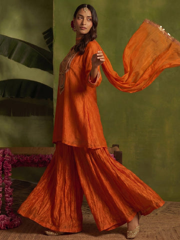 Rust Yoke Embroidered Kurta With Flared Sharara And Dupatta.