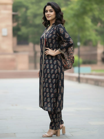 Angrakha-fit printed kurta set with mandarin collar and three-quarter sleeves, matched with straight trousers.