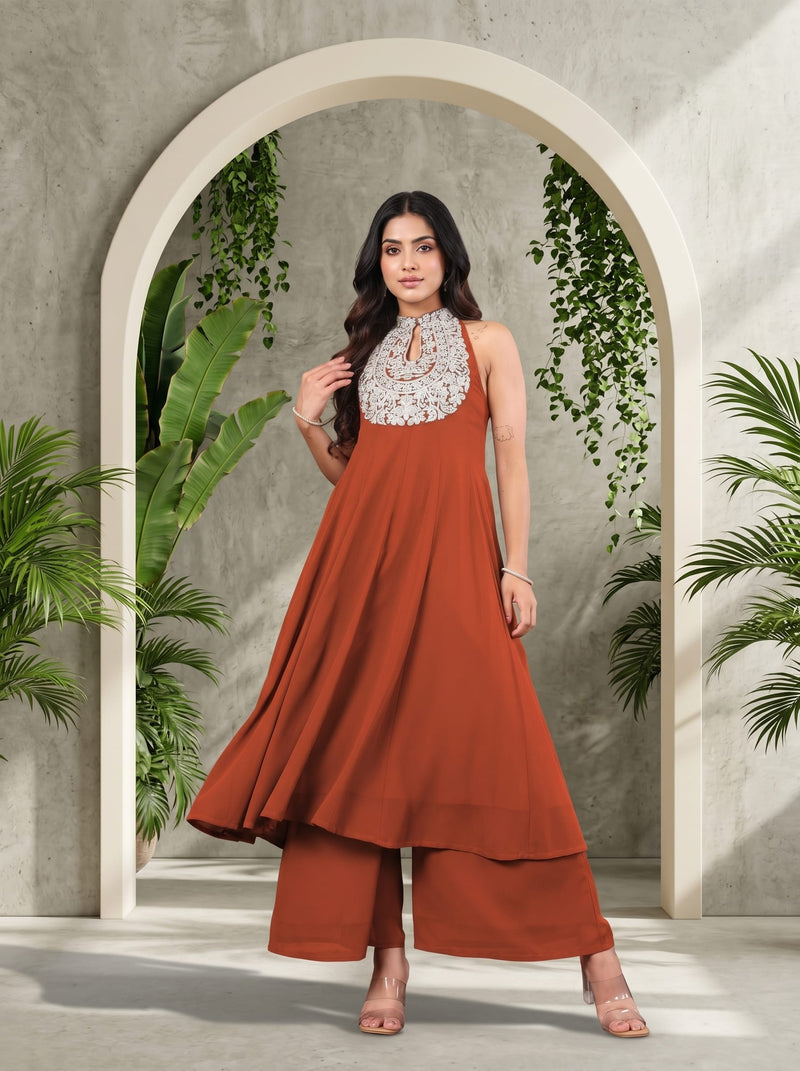 Varanga Women Rust Yoke Embroidered Sleeveless Flared Kurta With Trousers.