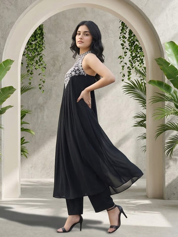 Black halter-neck A-line kurta featuring delicate white floral embroidery with matching solid trousers.