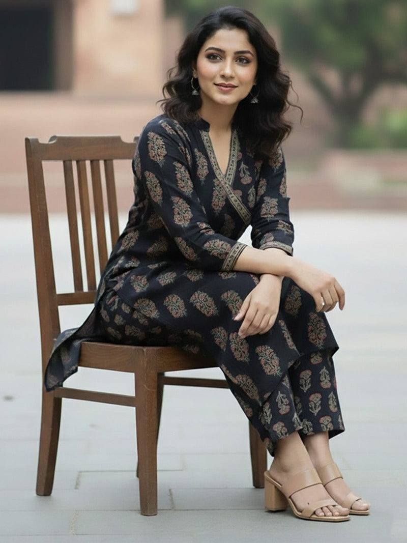 Angrakha-fit printed kurta set with mandarin collar and three-quarter sleeves, matched with straight trousers.