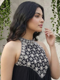 Black halter-neck A-line kurta featuring delicate white floral embroidery with matching solid trousers.