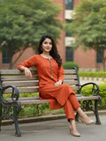 Solid straight-fit kurta with graceful embroidery and a round neckline, paired with full-length elasticated straight trousers.