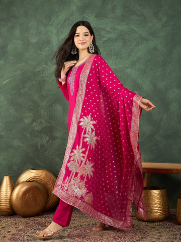 Fuchsia kurta set featuring a bead-embellished yoke, solid ankle-length trousers, and a brocade dupatta