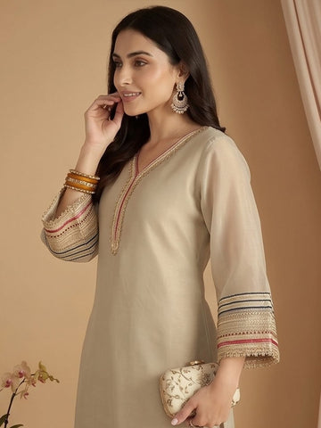 Varanga Women Three-Piece Set Featuring A Shimmer-Detailed Grey Kurta, Solid Ankle-Length Trousers, And An Embroidered Net Dupatta