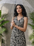 Sleeveless halter-neck floral kurta set in black and white tone, styled with printed full-length trousers.