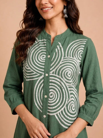 Green Embroidered Dress Featuring Bold Spiral Thread Work