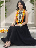 Black halter-neck A-line kurta featuring delicate white floral embroidery with matching solid trousers.