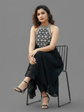 Black halter-neck A-line kurta featuring delicate white floral embroidery with matching solid trousers.