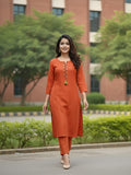 Solid straight-fit kurta with graceful embroidery and a round neckline, paired with full-length elasticated straight trousers.