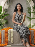 Sleeveless halter-neck floral kurta set in black and white tone, styled with printed full-length trousers.