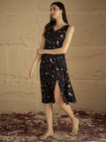 A Sleek Black Floral-Printed Knee-Length Dress With A V-Neckline And Side Slitâ€”Sleeveless, Stylish, And Perfect For Effortless Day-To-Evening Charm.