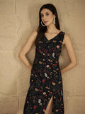 A Sleek Black Floral-Printed Knee-Length Dress With A V-Neckline And Side Slitâ€”Sleeveless, Stylish, And Perfect For Effortless Day-To-Evening Charm.